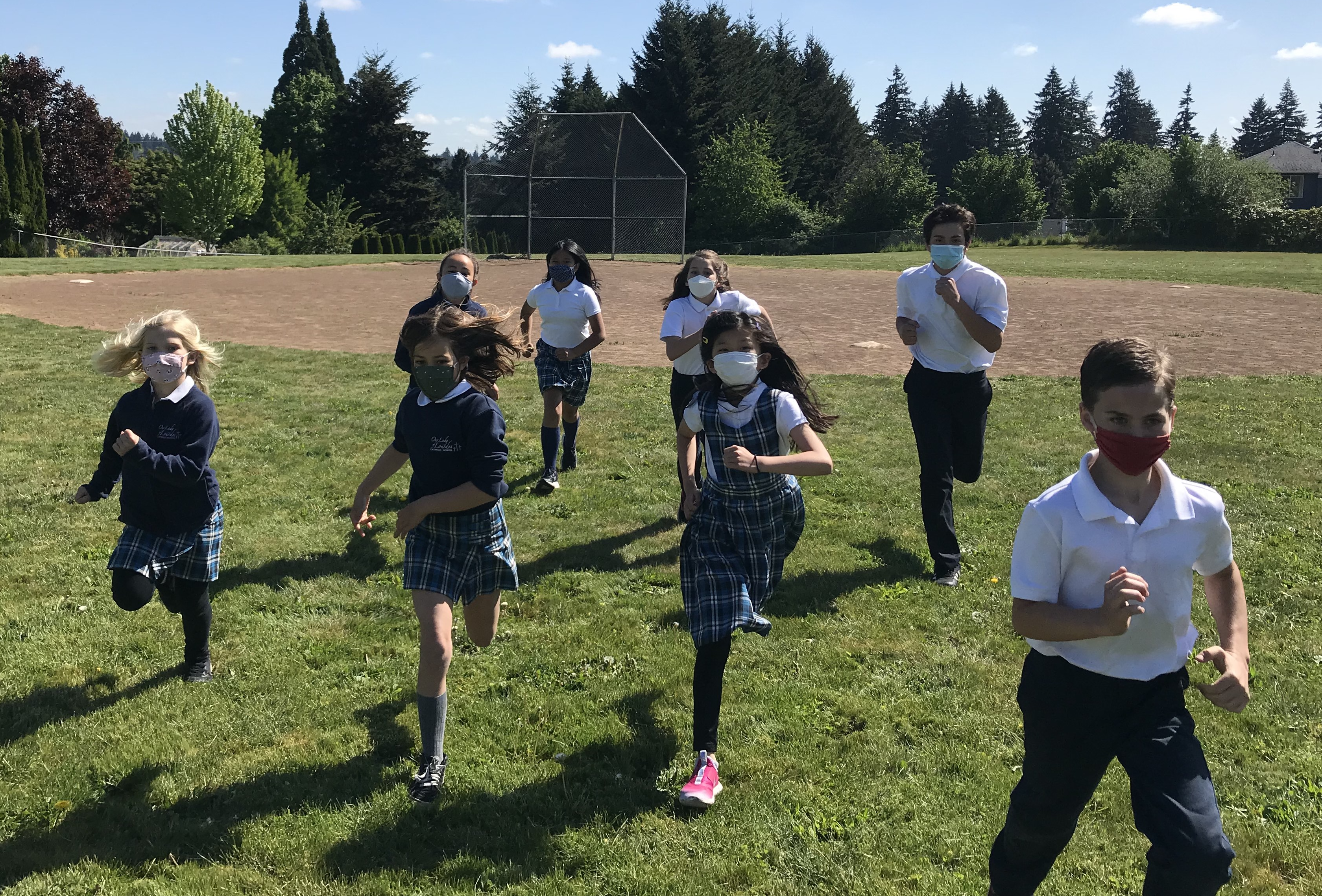 Our Lady of Lourdes Catholic School Students Running Through Field COVID Safe